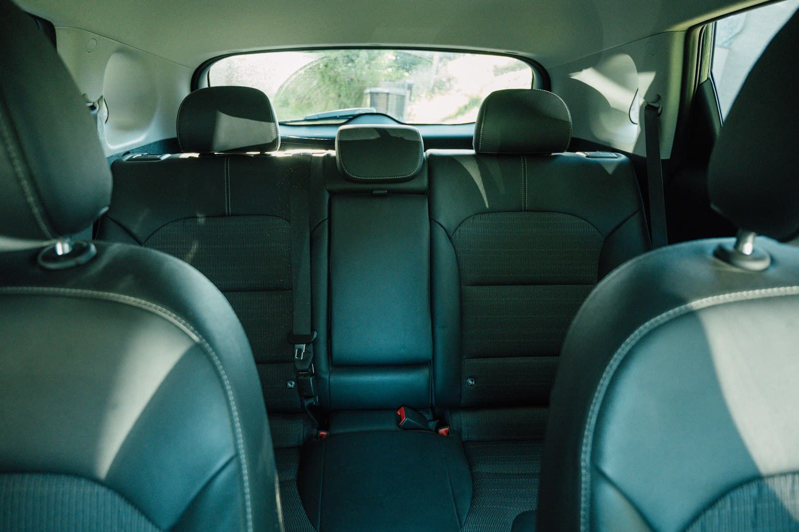 Freshly cleaned car cabin viewed from the rear seats